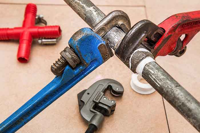 FLOW-PRO PLUMBING SOLUTIONS Logo